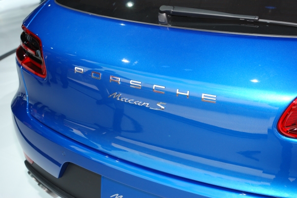 Blue 2014 Porsche Macan_ rear view with badging and reflections_LA Auto Show_ November 23, 2013